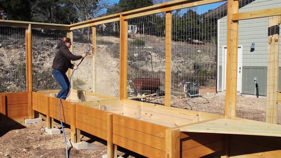 enclosed walk in garden with raised beds00 12 15 28still062